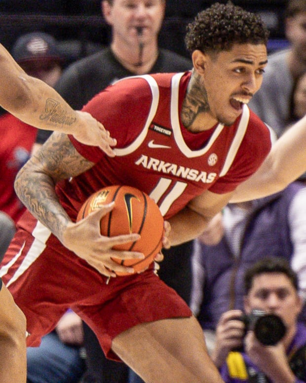 Razorbacks Jalen Lewis surrounded by Tigers on Saturday